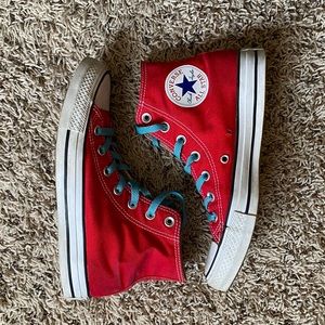 Women’s red Chuck Taylor Converse sneakers with blue laces. Size 7